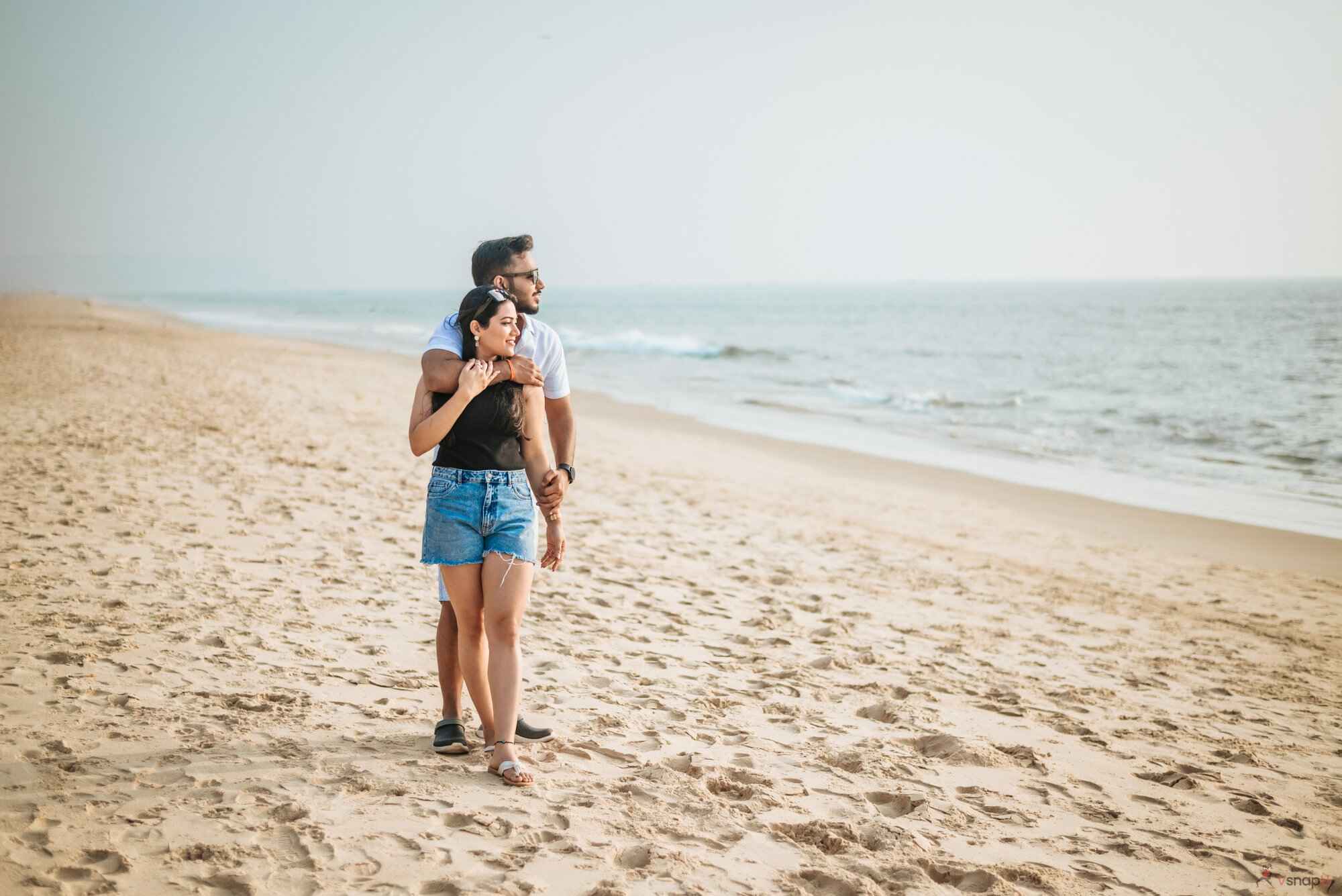 Affectionate pair enjoying sunset beach walk VsnapU moments in Amravati 1.jpg