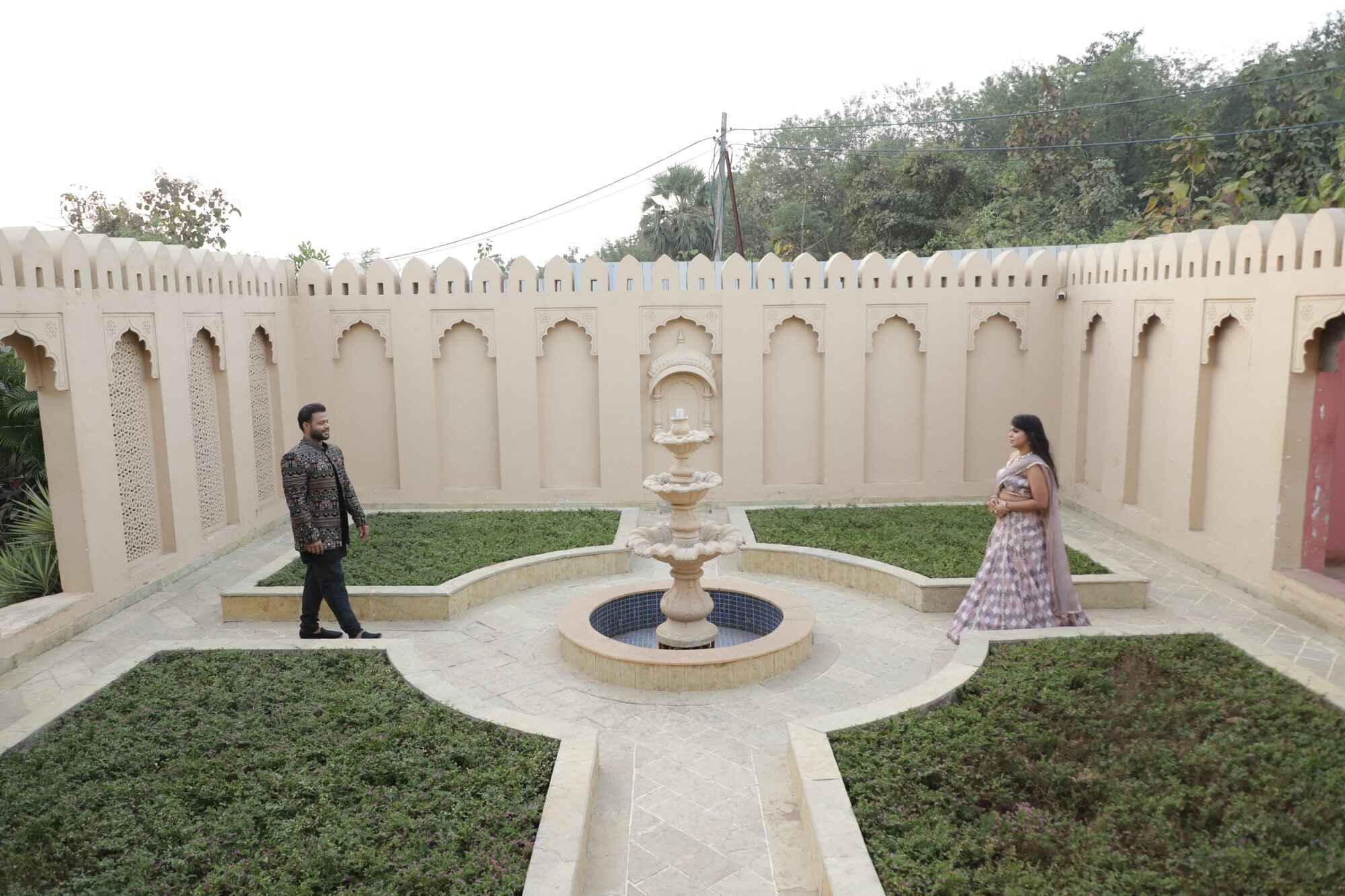 Couple in elegant courtyard captured by VsnapU in Ujjain 4.jpeg