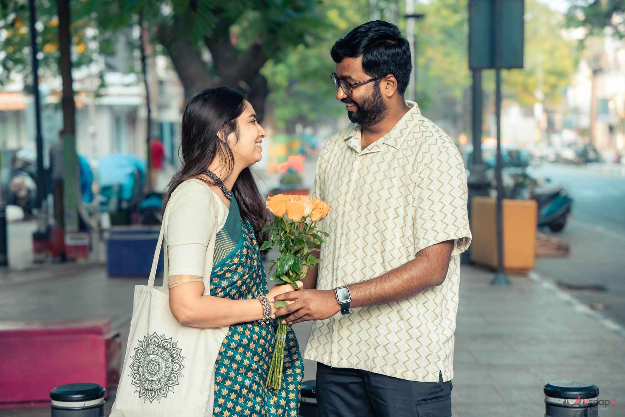 Couple embracing while holding flowers captured by VsnapU in Ambattur 2.jpg